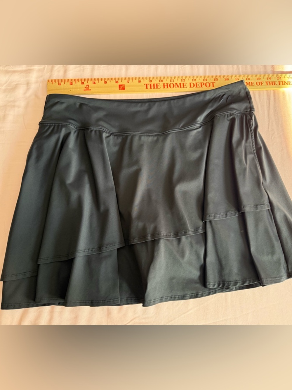 Black ruffled swim skirt with inner shorts. 1X